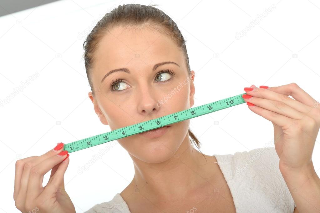Healthy Young Woman Holding a Tape Measure Stock Photo by ©richardmlee  71393701